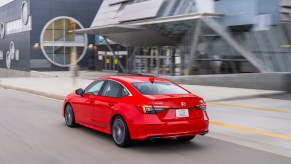 a red 2022 honda civic, a new sedan that is both efficient and fast