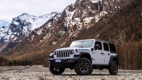 A 2022 Jeep Wrangler Rubicon 4xe plug-in hybrid SUV parked in the mountains