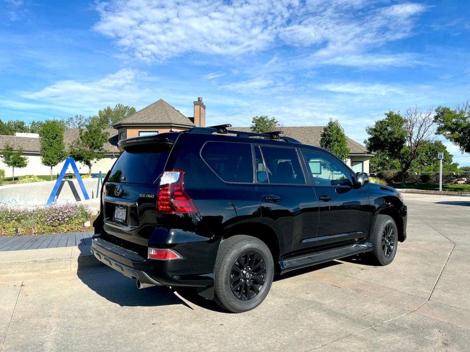 A rear view of the 2022 Lexus GX 460 Black Line sitting in front of a building