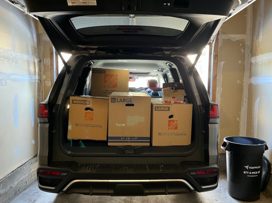 A full bed of cargo loaded into the back of the Lexus LX 600.
