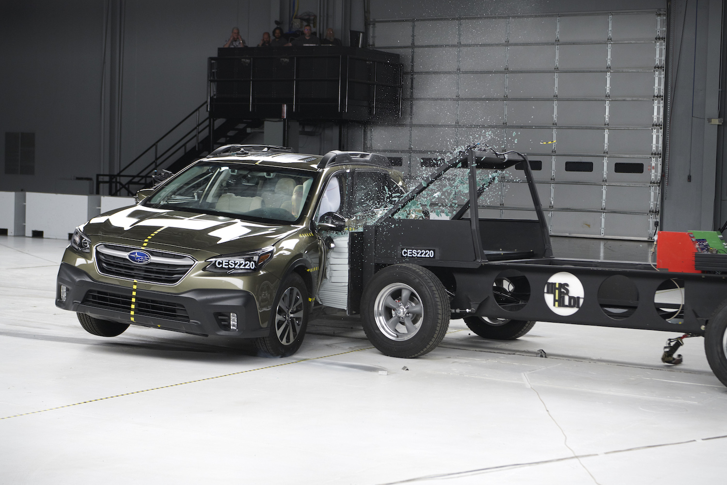 Action shot taken during the Institute's new side-impact crash test being conducted on the 2022 Subaru Outback SUV