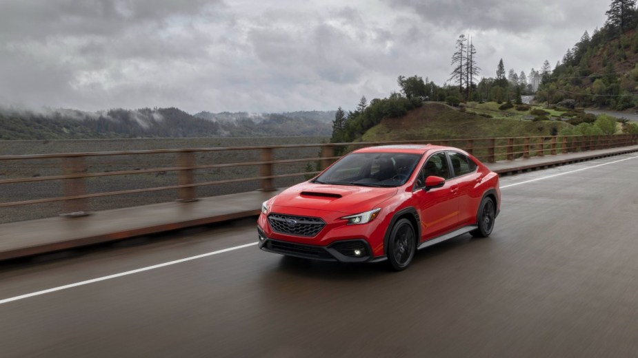 a red 2022 subaru wrx, a surprisingly efficient sedan that is fun to drive