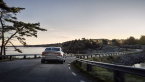 2022 Volvo S60 driving down a road.