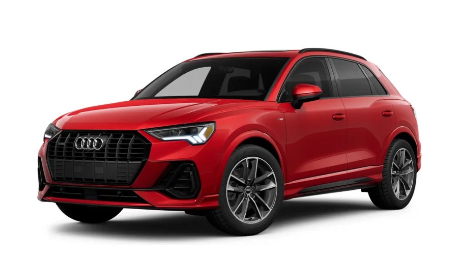 A red 2023 Audi Q3 against a white background.