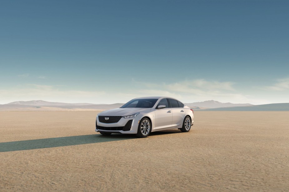 A 2023 Cadillac CT5 Premium Luxury midsize luxury sedan parked on a flat desert sand plain