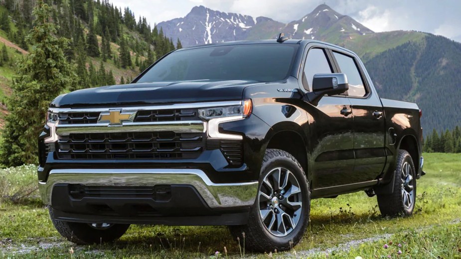 2023 Chevy Silverado 1500 sitting on grass with a mountain background