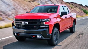 Red 2023 Chevy Silverado Trail Boss on the highway