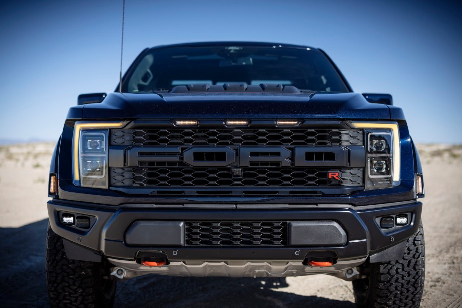 Closeup of the grille of a 2023 Ford Raptor R with its signature amber-colored marker lights.