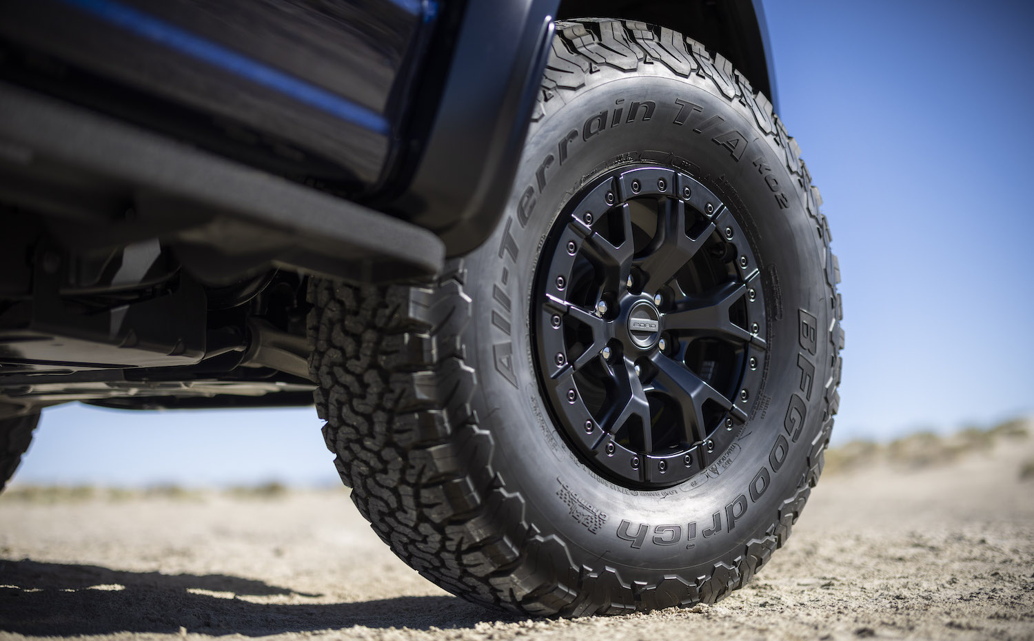 Closeup of a Ford F-150 37-inch BFGoodrich All-Terrain tire parked in the desert.