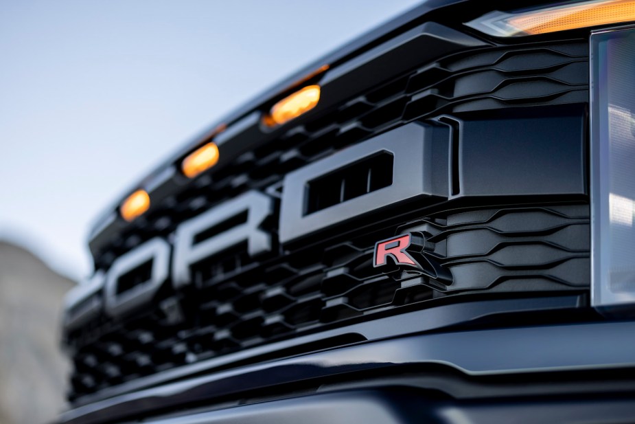 Closeup of a Ford F-150 Raptor R supertruck's "R" logo.