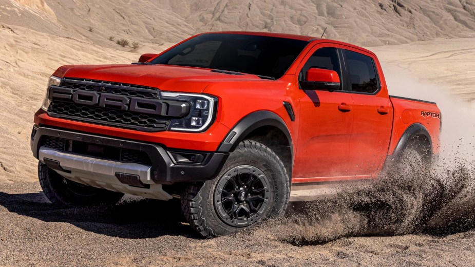 The 2023 Ford Ranger Raptor midsize truck plays in the sand