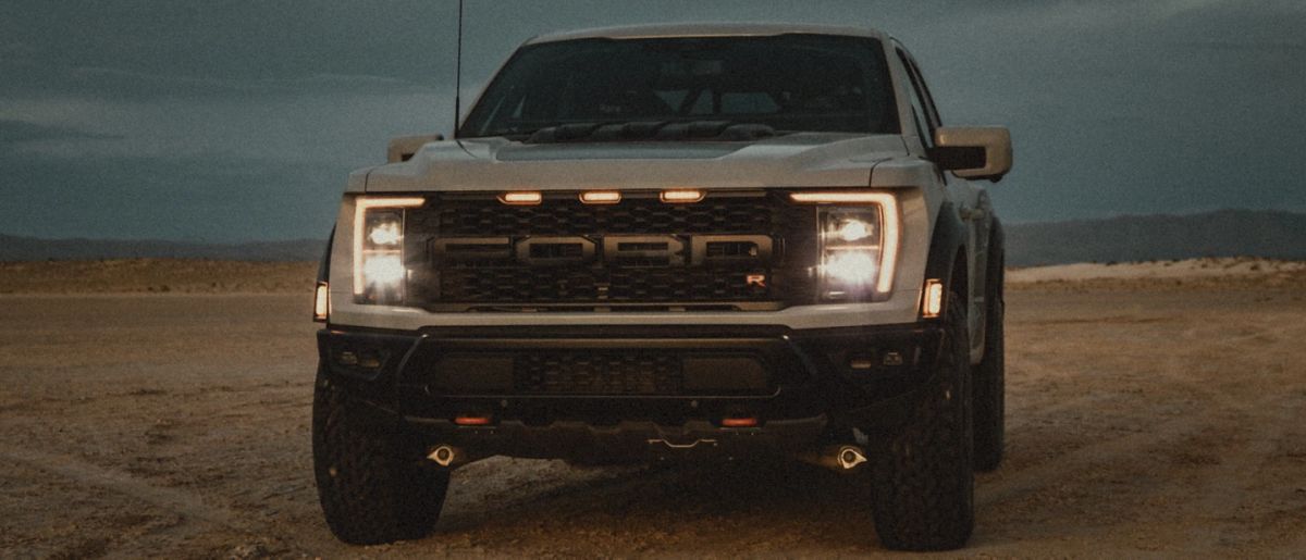 The Ford Raptor R in tan on dirt. It will have a 700-horsepower V8. 