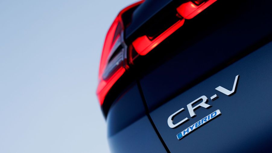 Model and trim badging on the trunk of the 2023 Honda CR-V Hybrid compact SUV model