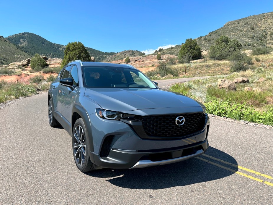 The 2023 Mazda CX-50 on a mountain road.