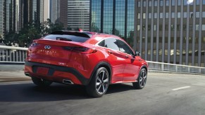 A 2023 Infiniti QX55 in red driving. What's new for the next model year?