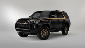 A black 2023 Toyota 4Runner with yellow and red stripes.