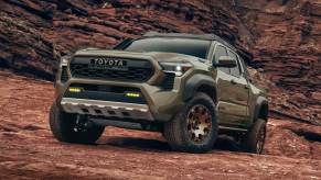 The 2024 Toyota Tacoma Hybrid off-roading in mud