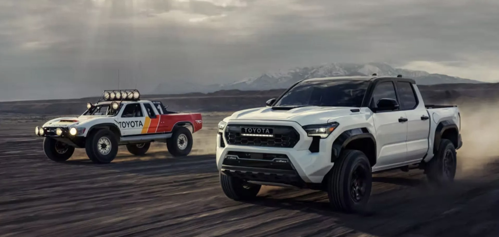The 2024 Toyota Tacoma racing a retro model