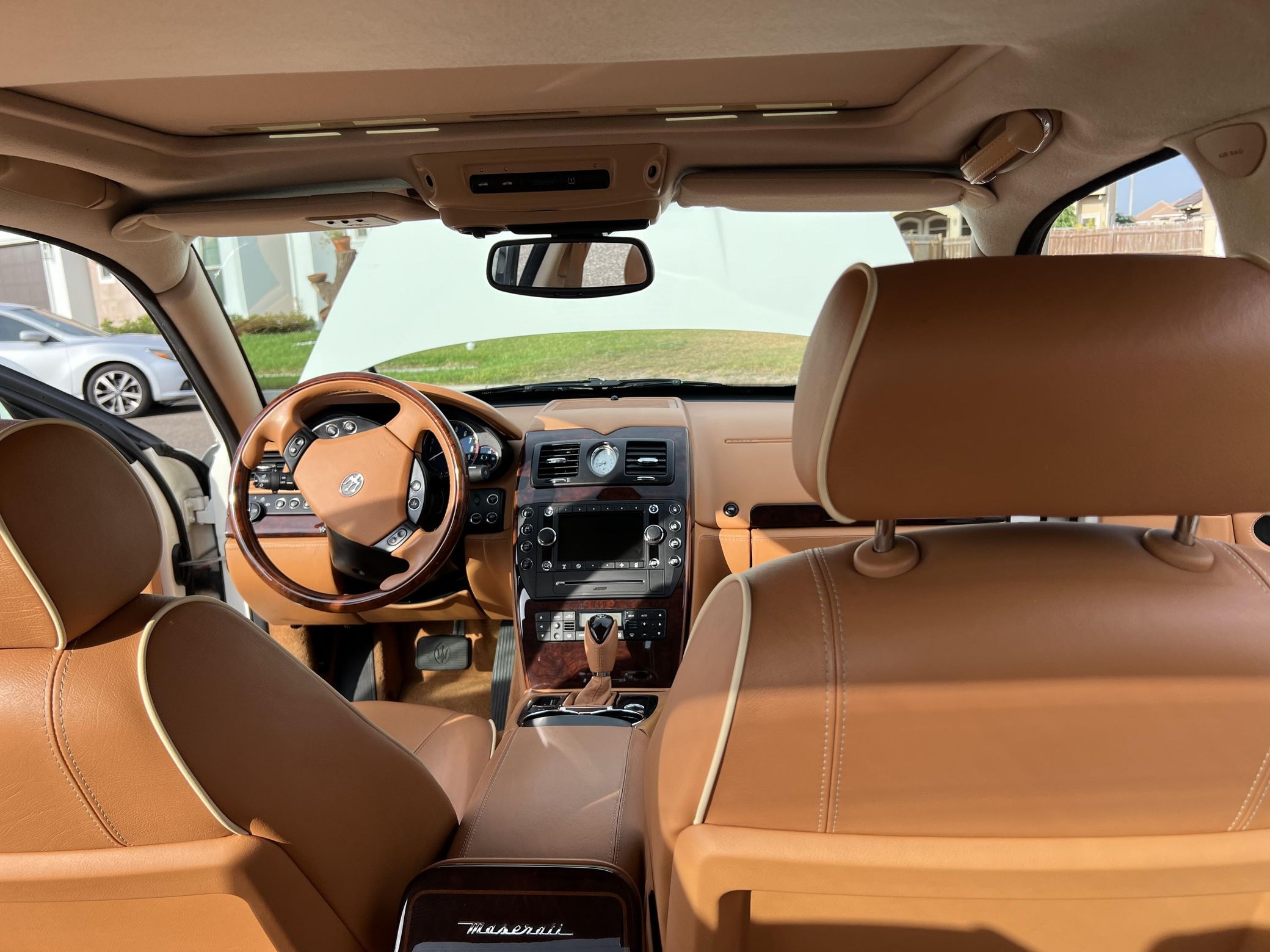 The brown-leather interior and dashboard of a 2010 Maserati Quattroporte S
