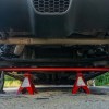 A red aftermarket Neu-f torsion bar mounted in the rear of a 2013 Fiat 500 Abarth