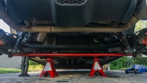 A red aftermarket Neu-f torsion bar mounted in the rear of a 2013 Fiat 500 Abarth