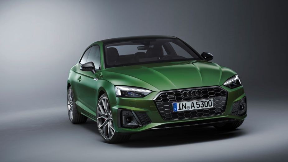 A promotional shot of a green Audi A5 Coupe luxury car model