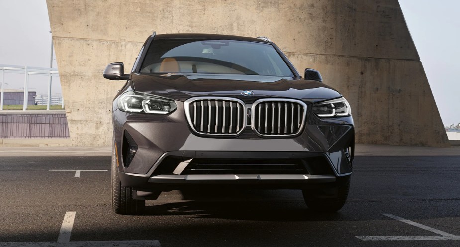 A black 2022 BMW X3 luxury compact SUV is parked. 