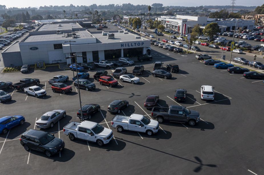 a dealer lot with a mix of cars and trucks
