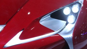 A red car where the headlights work.