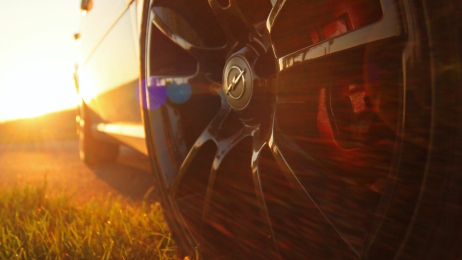 Car tire and sunset, showing how tire particles that shed cause water pollution