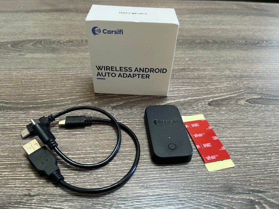 The Carsifi adapter with its USB cables and box.