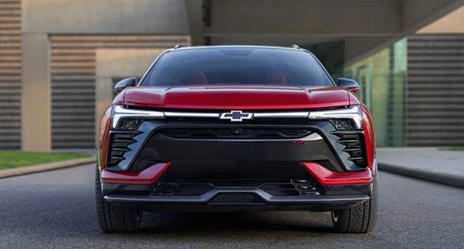 A red Chevrolet Blazer EV electric SUV is parked.