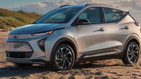 A gray 2022 Chevy Bolt EUV is parked on the sand.