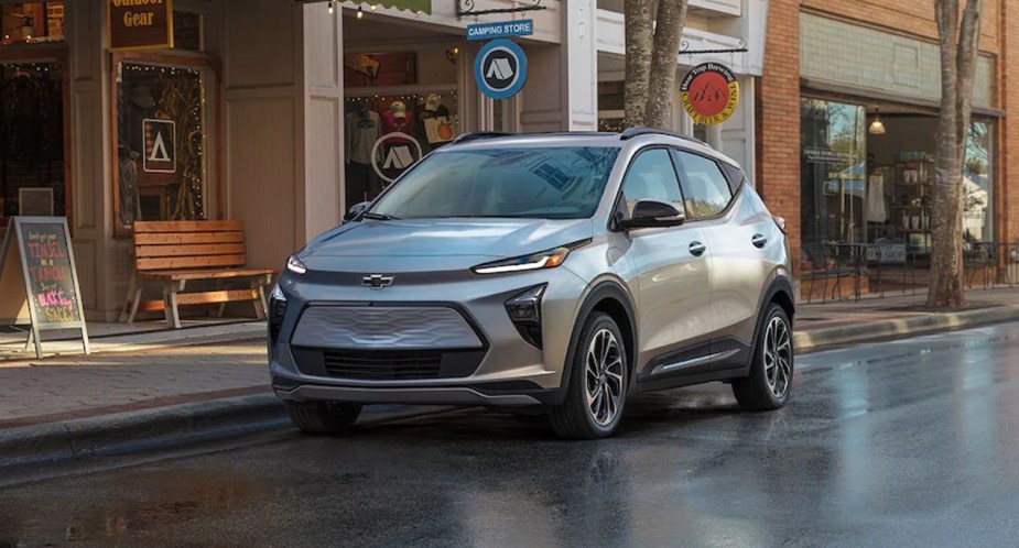 A gray 2022 Chevy Bolt EUV electric subcompact SUV is parked on the road. 