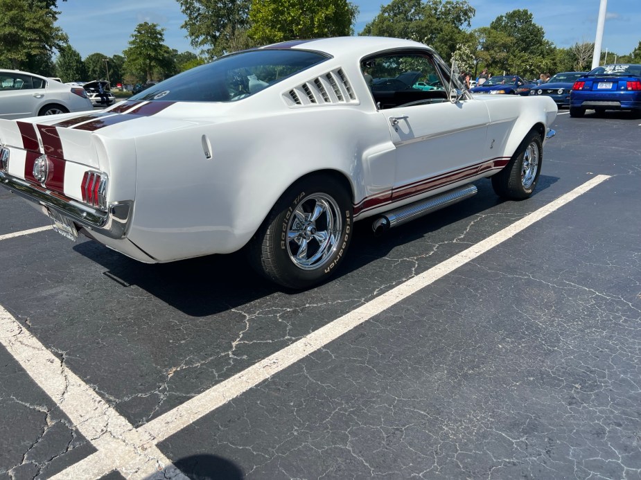 A Classic Mustang in white with red racing stripes at Myrtle Beach Mustang Week