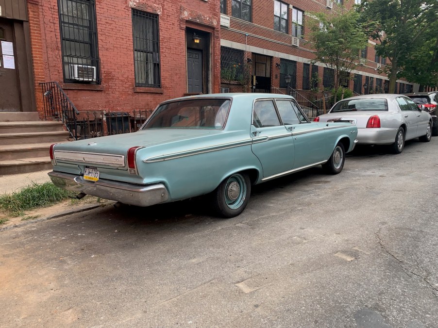 Aqua colored Dodge 440 classic car in the city.