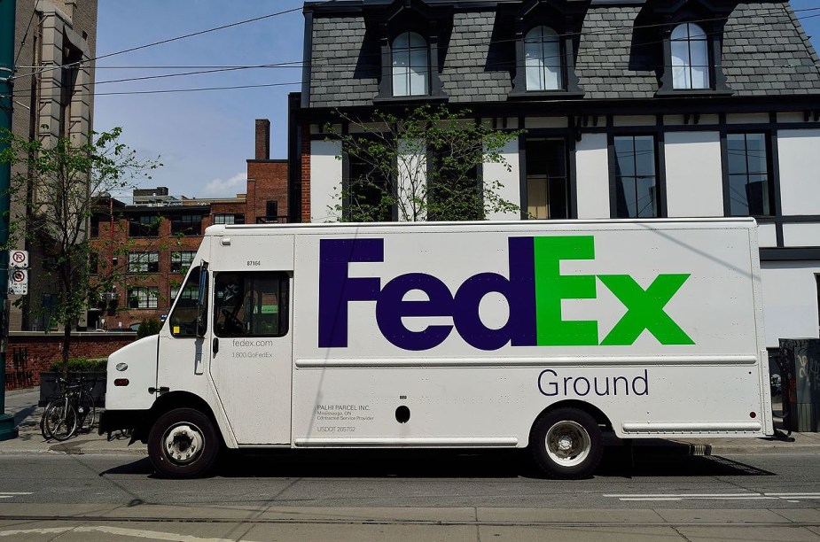 A FedEx delivery truck. One has been converted into a camper van. 