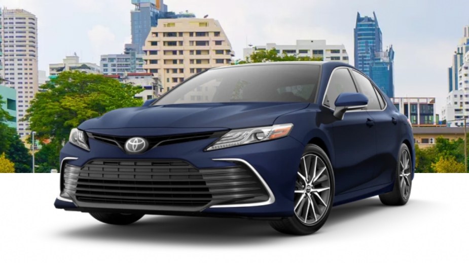 Front angle view of 2023 Toyota Camry midsize sedan with Reservoir Blue exterior paint color option