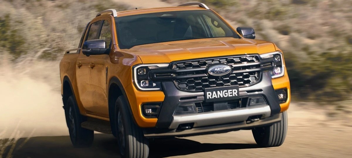 Front angle view of Cyber Orange 2024 Ford Ranger midsize pickup truck