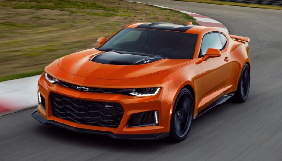 Front angle view of gas-powered orange 2022 Chevy Camaro, which will be killed to make way for EVs
