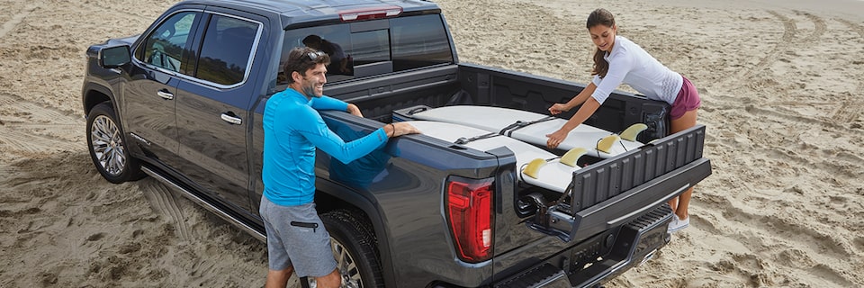 A gray GMC Sierra showing how the MultiPro tailgate works. 
