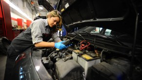 An automotive technician working on a car.