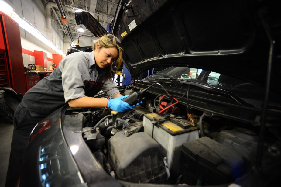 An automotive technician working on a car.
