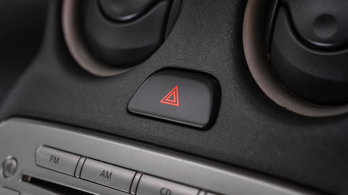 Button for the hazard lights in a car