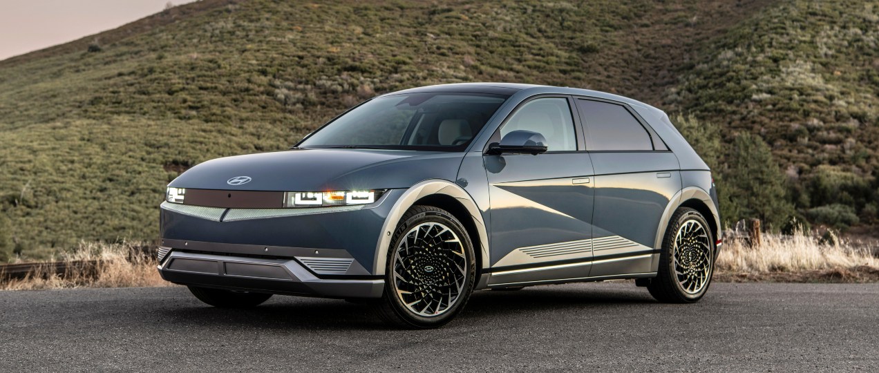 A blue 2023 Hyundai Ioniq 5 electric SUV is parked.