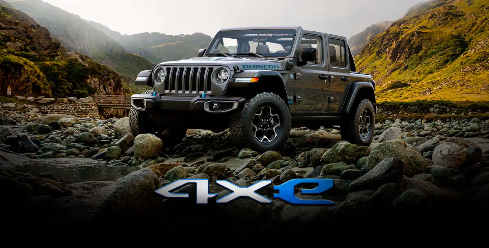 The Jeep Wrangler Rubicon 4xe plug-in hybrid electric vehicle (PHEV) parked on a plateau of rocks and pebbles