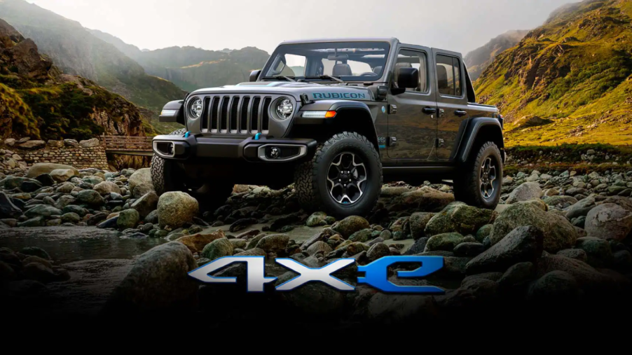 The Jeep Wrangler Rubicon 4xe plug-in hybrid electric vehicle (PHEV) parked on a plateau of rocks and pebbles