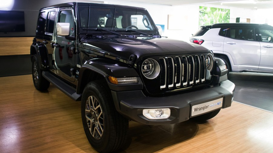 A black Jeep Wrangler parked indoors.
