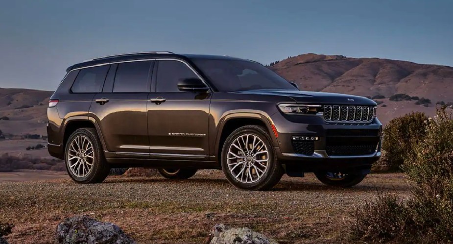 A green 2023 Jeep Grand Cherokee is parked. 