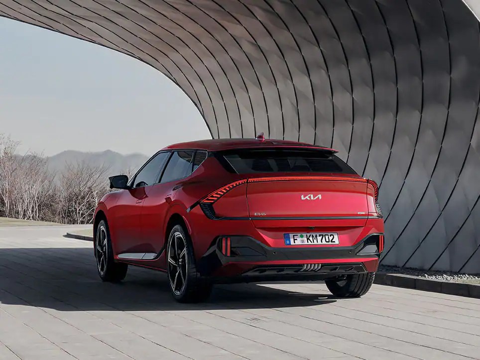 A red 2023 Kia EV6 GT shows off its performance as an electric SUV.